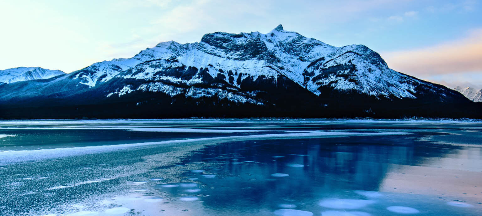 Ice bubbles trapped in the frozen surface of Abraham Lake, Alberta